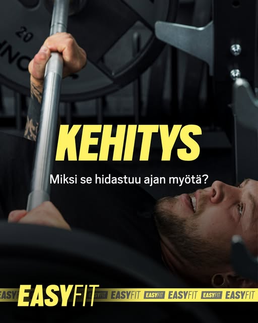 Mies tekee penkkipunnerrusta kuntosalilla, kehityksen ja harjoittelun edistäminen.